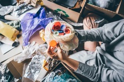 Woman sorting different waste girl holding a plas 2022 02 02 03 58 26 utc