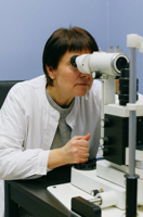 Woman in White Dress Shirt Using White Microscope Free Stock Photo
