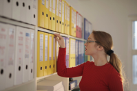 Woman Looking at Folders Free Stock Photo
