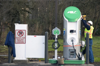 Workers assemble the charging station in Cottage Grove Oregon Smallman