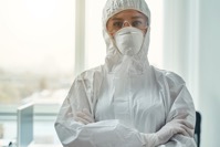 Young woman wearing protective suit and respirator 2021 09 03 15 37 35 utc